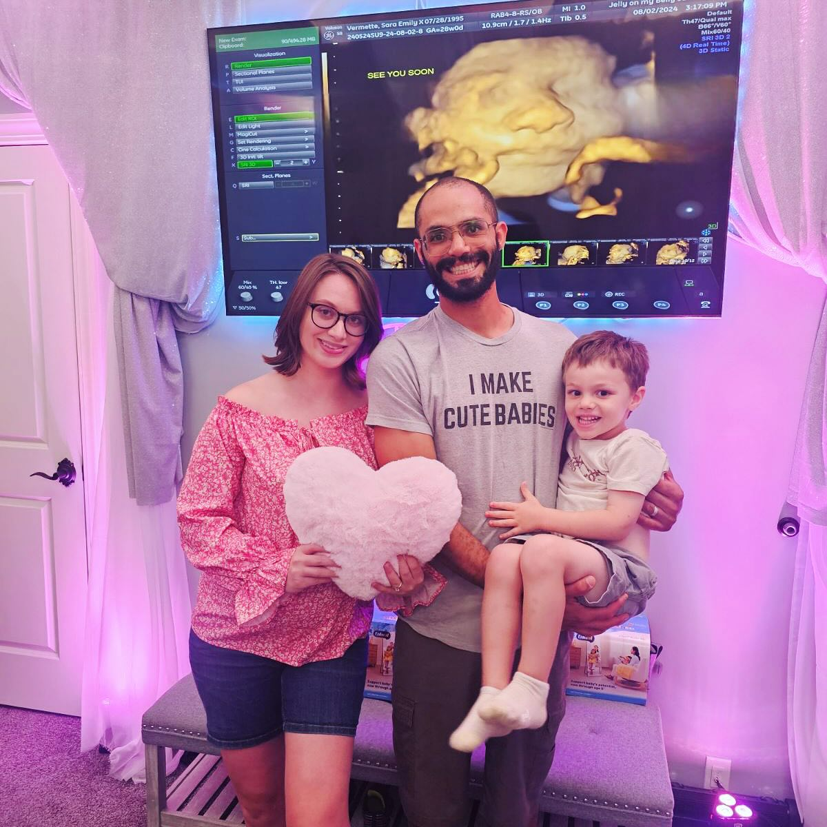 A happy expectant couple with their first child during a pregnancy ultrasound