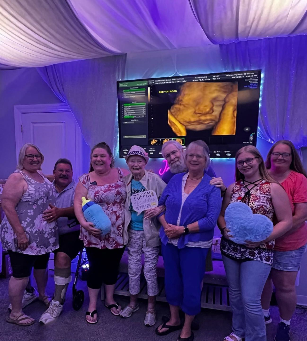 A family bonding during ultrasound as different relatives attend